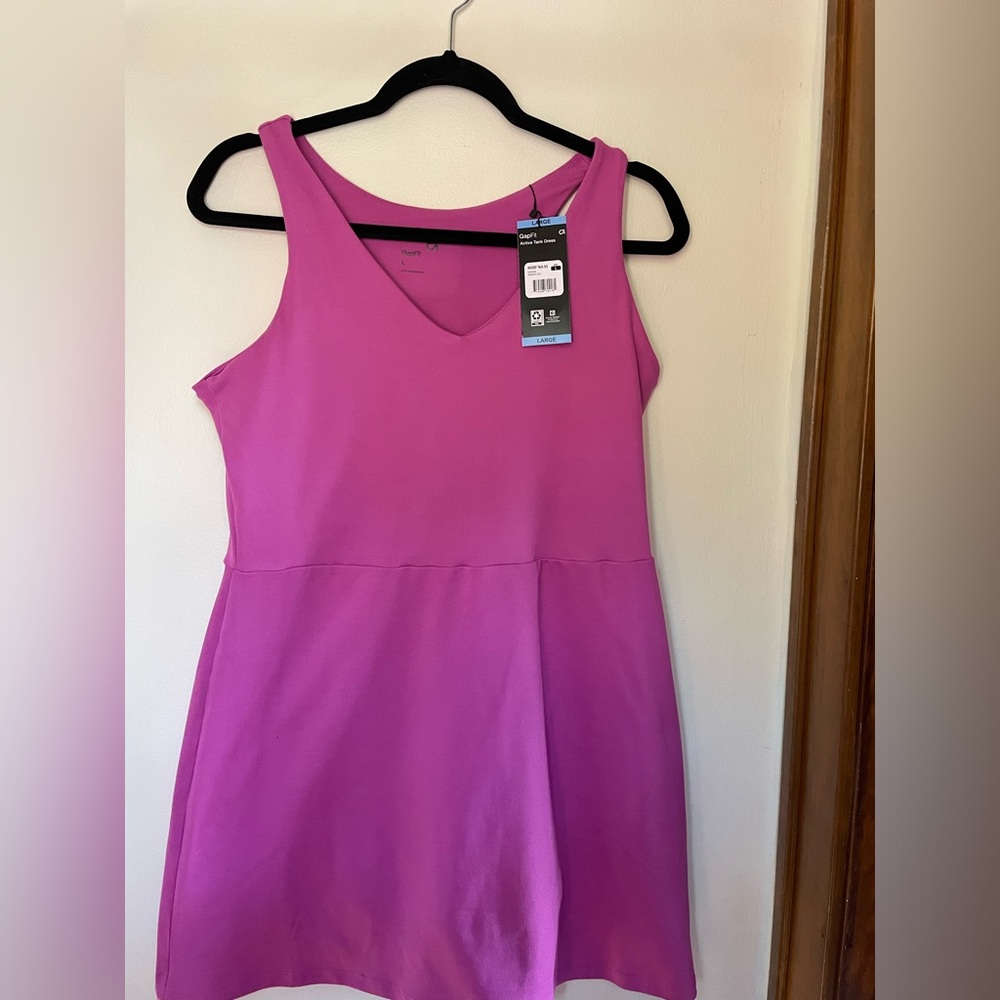 Pink gap for athletic dress with built in shorts and bra. Short has pockets.